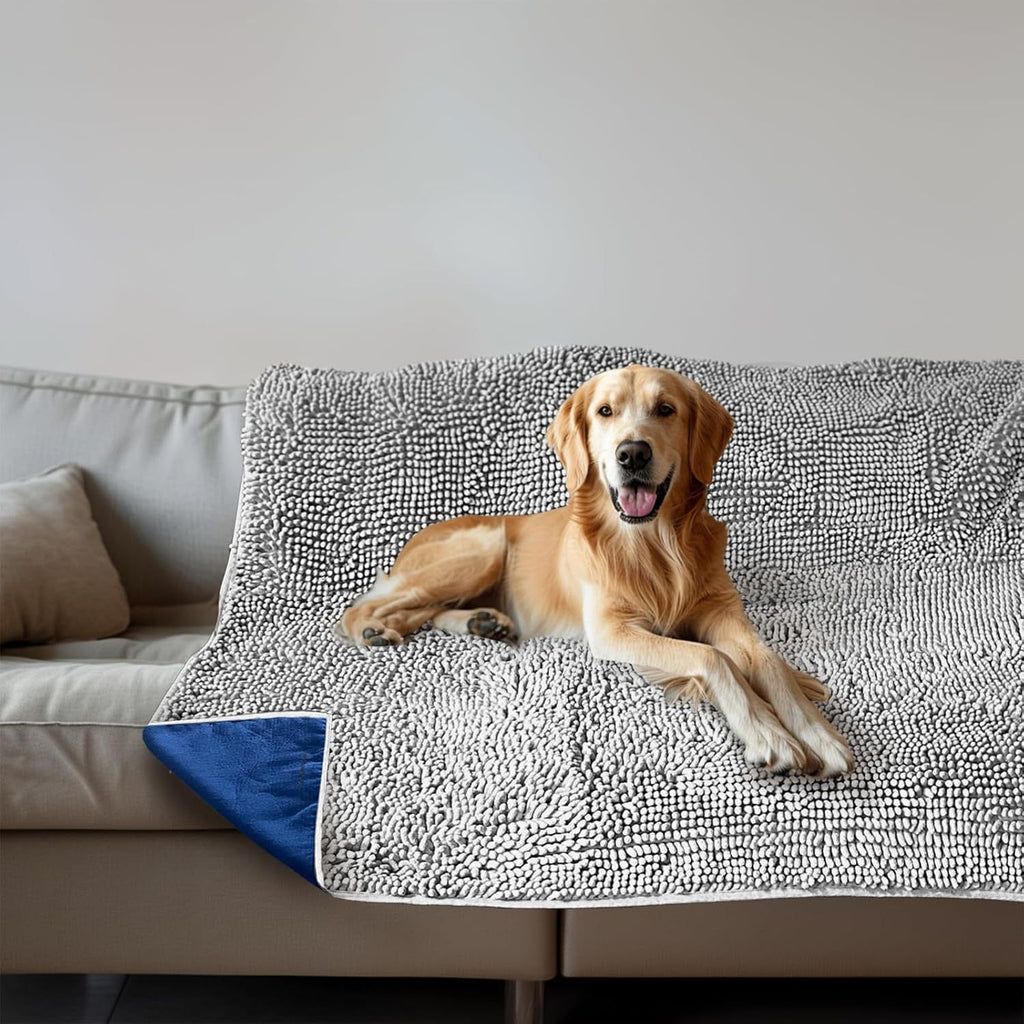 OCPAGA Silver Pebble Chenille dog blanket on a grey couch, Blue anti-slip backing on OCPAGA furniture protector
